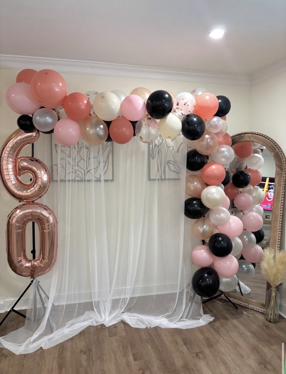 Rose gold, blush and black balloon garland with foil 60 balloons at a Philadelphia milestone birthday